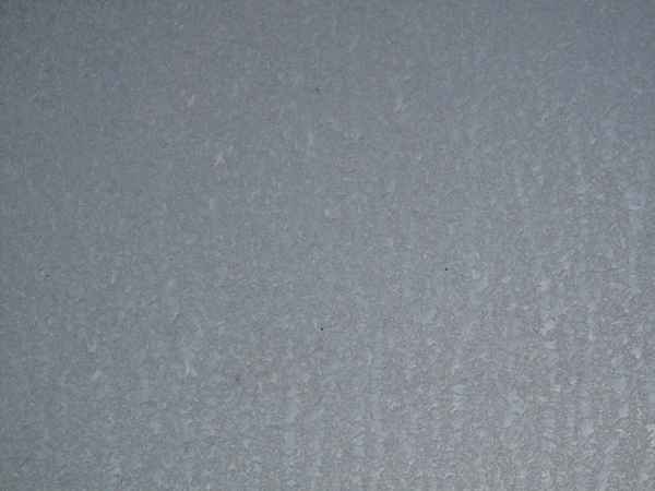 Frost hinter der Fensterscheibe