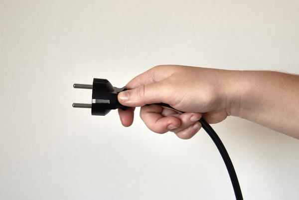 Power plug in a hand