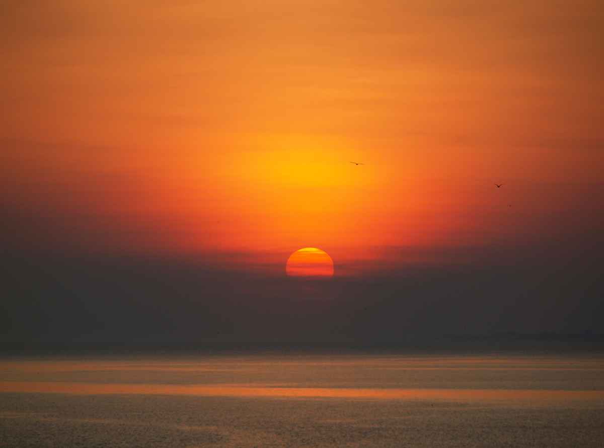 Untergehende Sonne am Meer 02