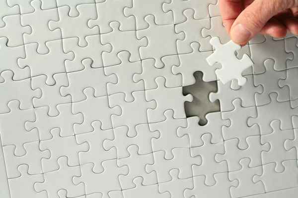 Puzzle mit Hand