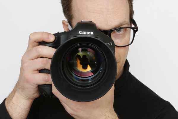 Fotograf / Mann mit Kamera