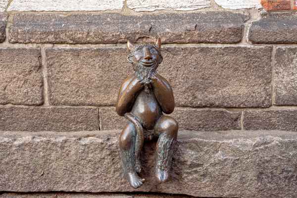 Teufelchen auf dem "Teufelsstein", Marienkirche Lübeck