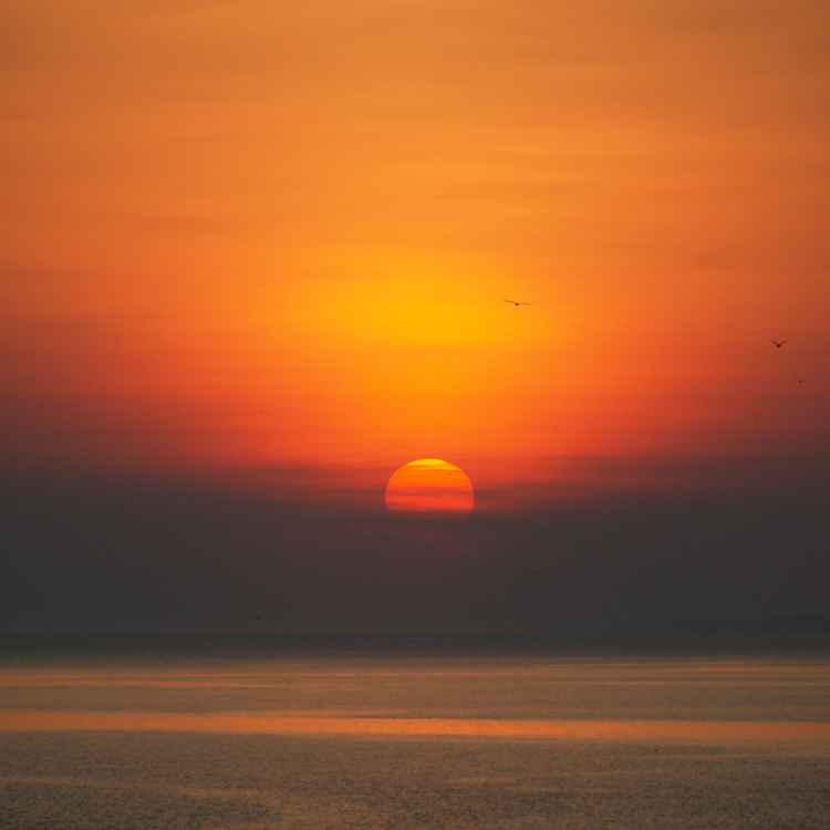 Untergehende Sonne am Meer 02