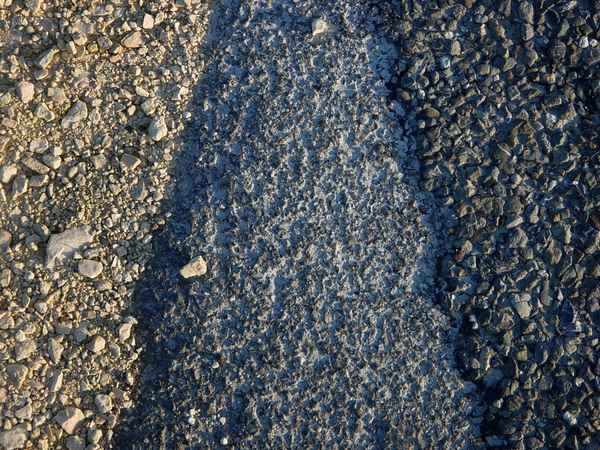 Belag am Strassenrand