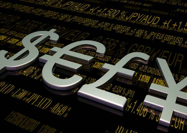 Währungssymbole mit Kursen im Hintergrund