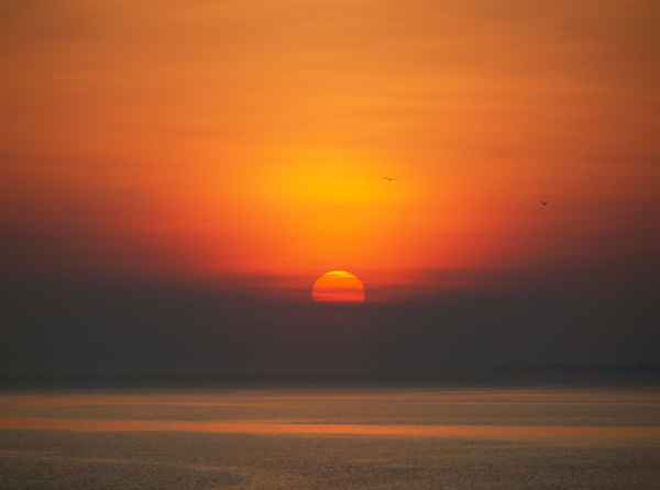 Untergehende Sonne am Meer 02