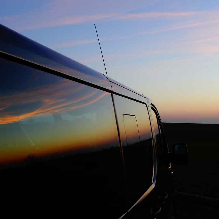 Abendrot Spiegelung an Auto
